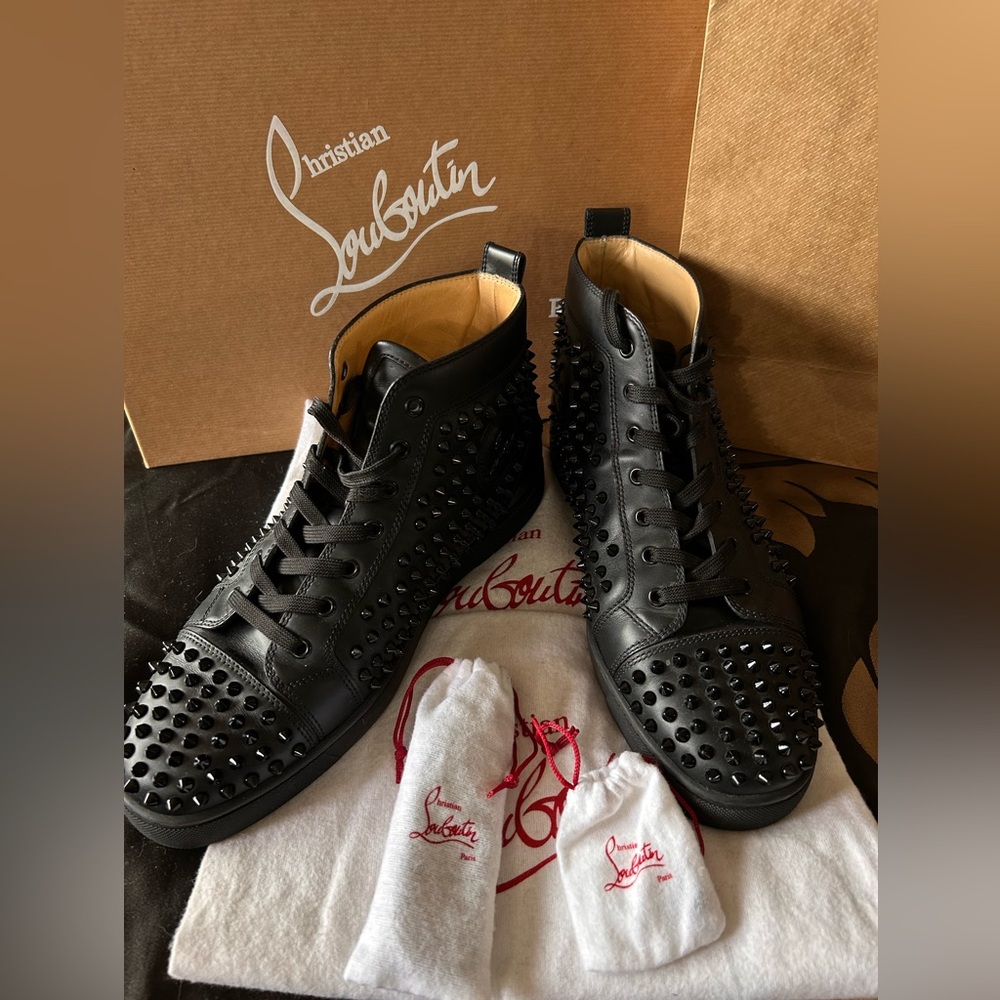 Classic black men’s Louboutin Spike sneaker , still on website